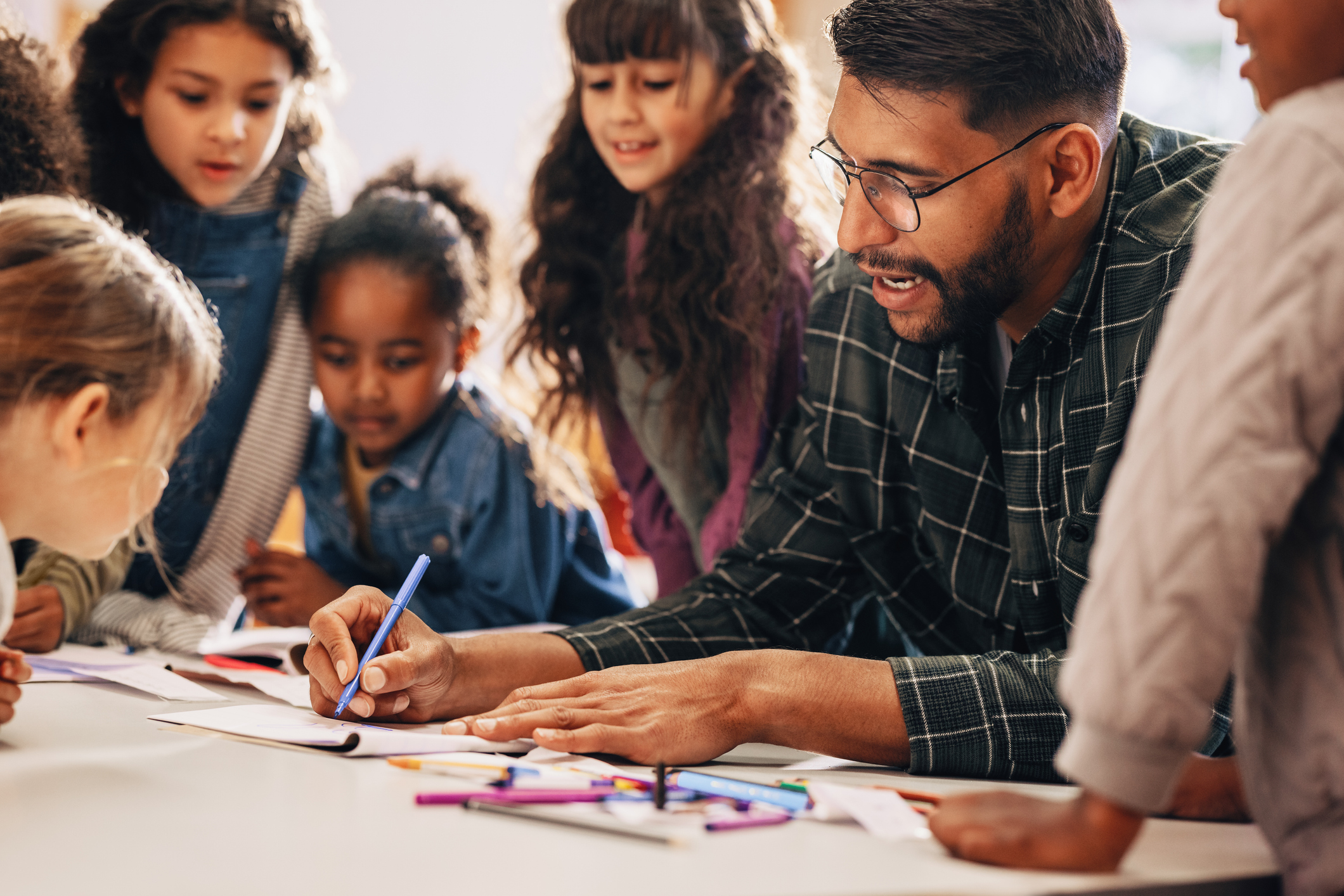 Diverse parents and teachers meeting together